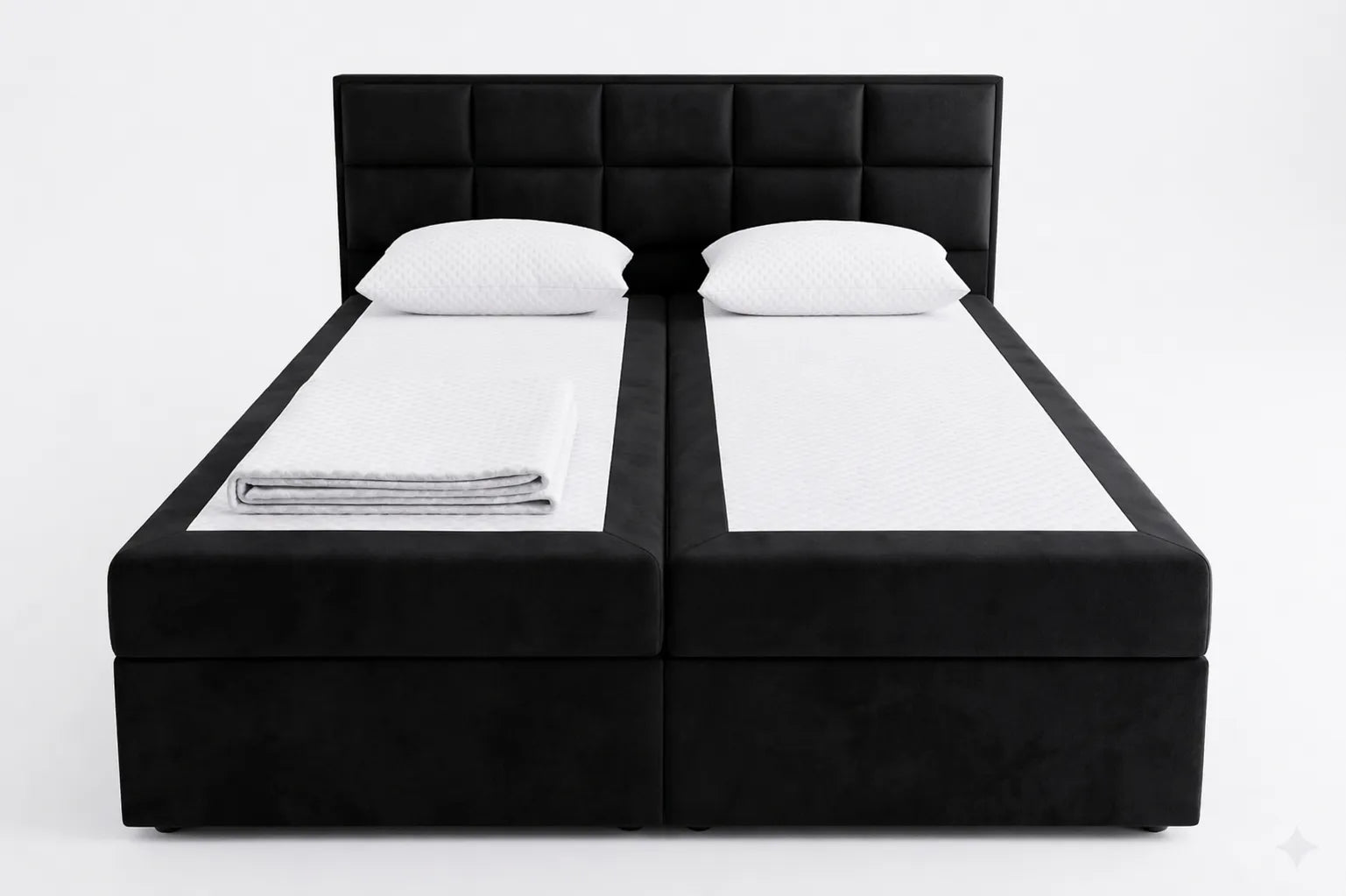 Black bed frame with white bedding on a white background