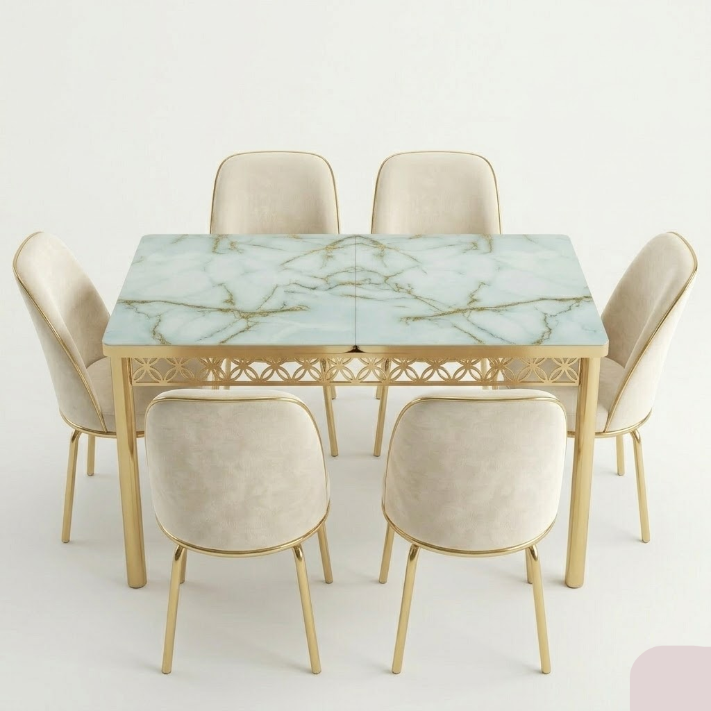 Dining table set with marble-like top and gold legs on a white background