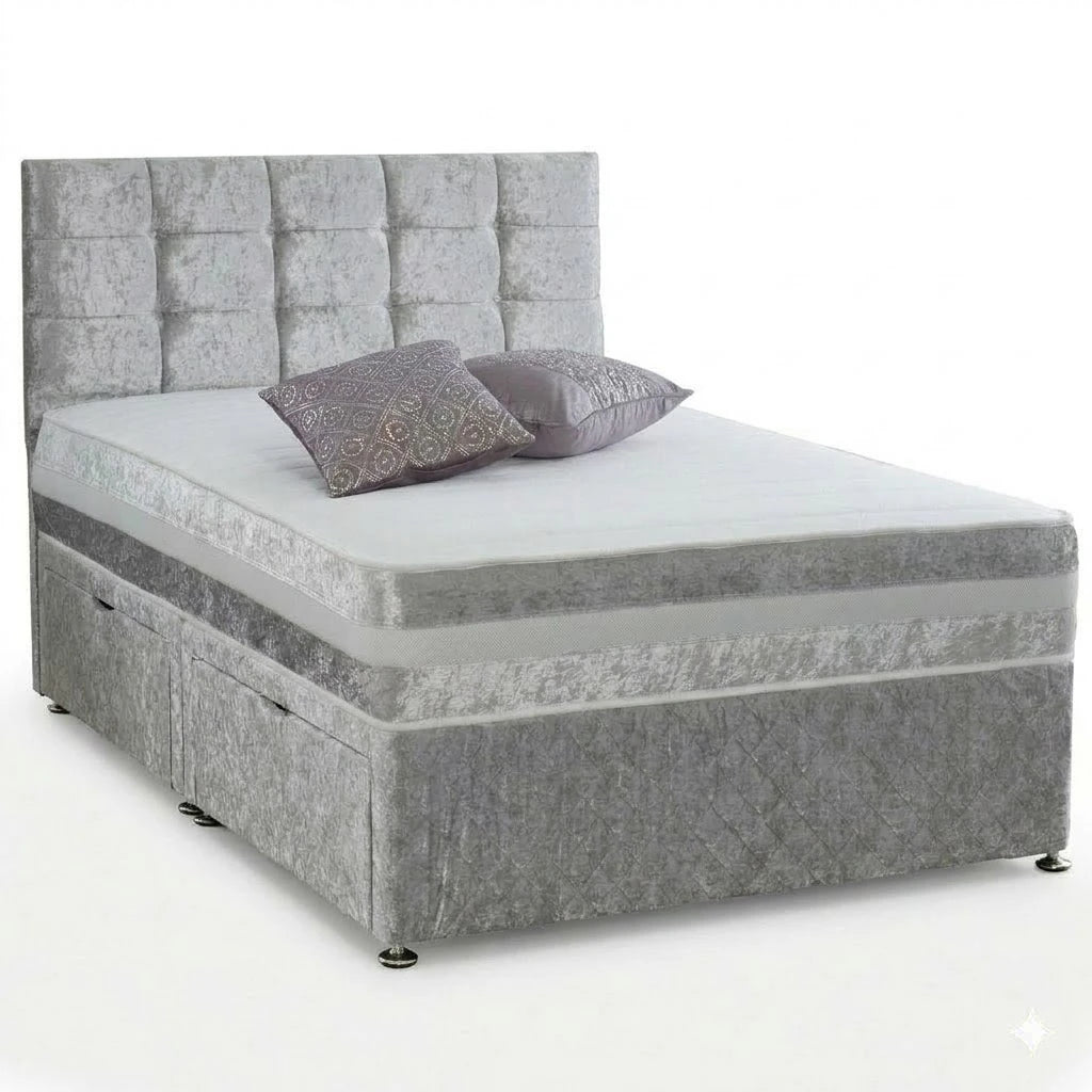 Gray upholstered bed with patterned headboard and pillows on a white background
