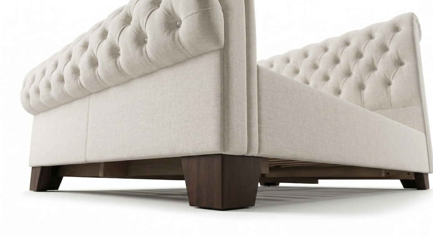 Beige tufted sofa with wooden legs on a white background