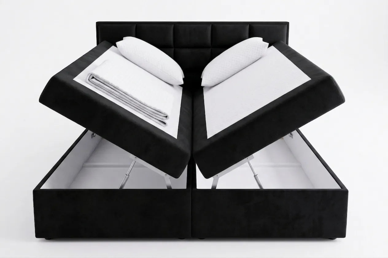Black jewelry box with open lid revealing white jewelry inside on a white background