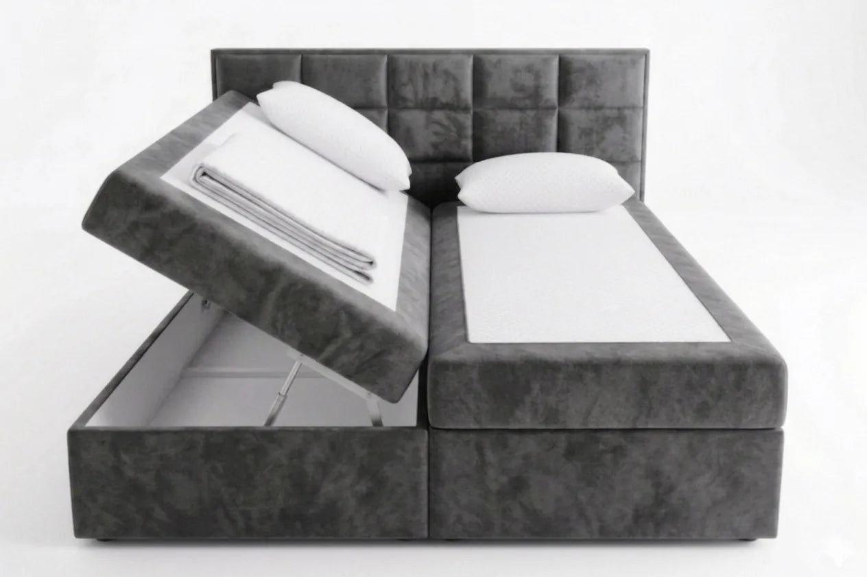 Gray upholstered bed with storage compartments on a white background