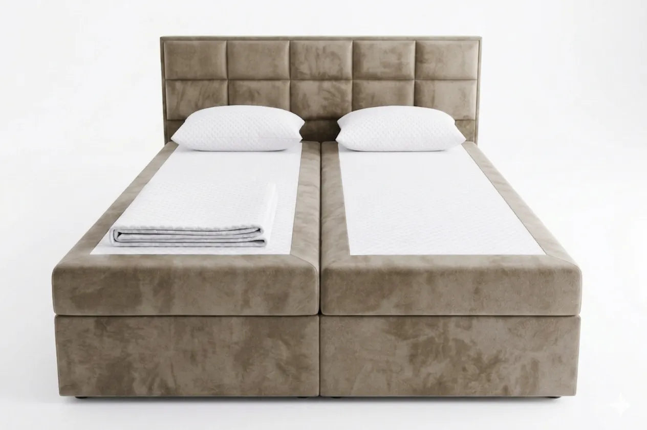 Beige upholstered bed with white bedding on a white background