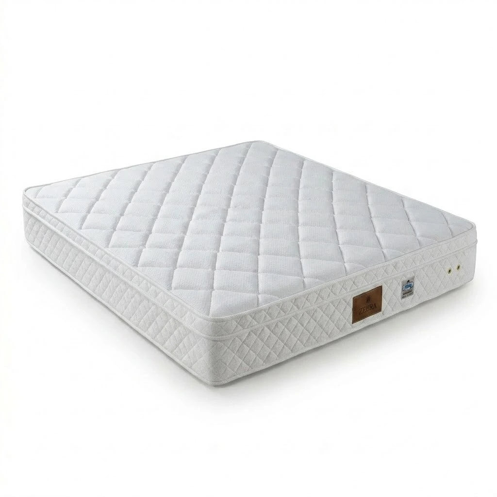White quilted mattress on a white background