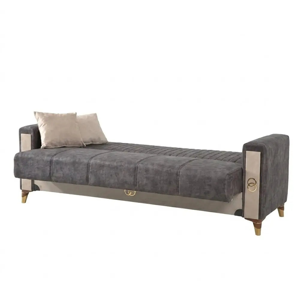 Gray upholstered bed with decorative pillows on a white background