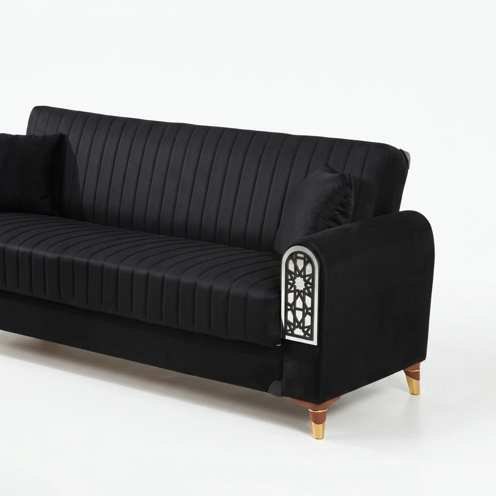 Black sofa with decorative armrest on a white background