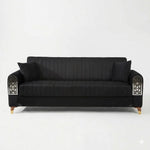 Black sofa with decorative armrests on a white background