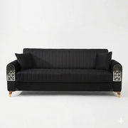 Black sofa with decorative armrests on a white background