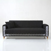 Black sofa with decorative pattern on a white background